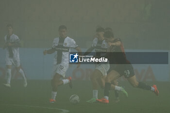 2024-11-04 - Simon Sohm (Parma Calcio) and Dennis Man (Parma Calcio) in action against Alessandro Zanoli (Genoa CFC) - PARMA CALCIO VS GENOA CFC - ITALIAN SERIE A - SOCCER