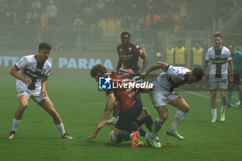 2024-11-04 - Emanuele Valeri (Parma Calcio) fights for the ball against Alessandro Zanoli (Genoa CFC) - PARMA CALCIO VS GENOA CFC - ITALIAN SERIE A - SOCCER