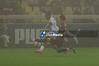 2024-11-04 - Woyo Coulibaly (Parma Calcio) in action against Johan Vasquez (Genoa CFC) - PARMA CALCIO VS GENOA CFC - ITALIAN SERIE A - SOCCER