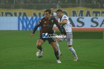 2024-11-04 - Alessandro Vogliacco (Genoa CFC) in action against Valentin Mihaila (Parma Calcio) - PARMA CALCIO VS GENOA CFC - ITALIAN SERIE A - SOCCER