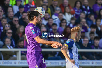 2024-11-10 - header of Fiorentina's Yacine Adli against Verona's Casper Tengstedt - ACF FIORENTINA VS HELLAS VERONA FC - ITALIAN SERIE A - SOCCER