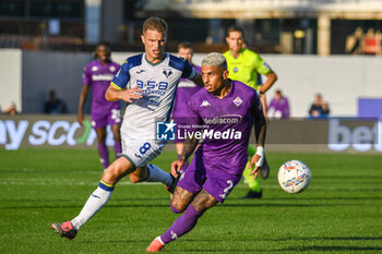 2024-11-10 - Fiorentina's Dodo fights for the ball against Verona's Darko Lazovic - ACF FIORENTINA VS HELLAS VERONA FC - ITALIAN SERIE A - SOCCER