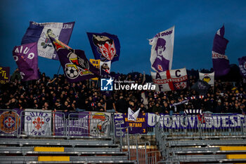 2024-11-24 - supporters of curva (ACF Fiorentina) Soccer - Italian ,Serie A - Como 1907 vs ACF Fiorentina , 2024-25 game at Stadio Giuseppe Sinigaglia in Como (CO), Italy, 24.11.2024. Photo by Marius Bunduc/LiveMedia - COMO 1907 VS ACF FIORENTINA - ITALIAN SERIE A - SOCCER