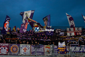 2024-11-24 - supporters of curva (ACF Fiorentina) Soccer - Italian ,Serie A - Como 1907 vs ACF Fiorentina , 2024-25 game at Stadio Giuseppe Sinigaglia in Como (CO), Italy, 24.11.2024. Photo by Marius Bunduc/LiveMedia - COMO 1907 VS ACF FIORENTINA - ITALIAN SERIE A - SOCCER