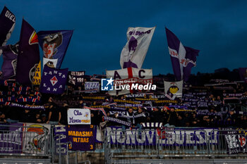 2024-11-24 - supporters of curva (ACF Fiorentina) Soccer - Italian ,Serie A - Como 1907 vs ACF Fiorentina , 2024-25 game at Stadio Giuseppe Sinigaglia in Como (CO), Italy, 24.11.2024. Photo by Marius Bunduc/LiveMedia - COMO 1907 VS ACF FIORENTINA - ITALIAN SERIE A - SOCCER