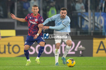 2024-11-24 - Bologna's Jesper Karlsson and Lazio’s Mario Gila during the Italian Football Championship League A 2024/2025 match between SS Lazio vs Bologna FC at the Olimpic Stadium in Rome on 24 November 2024. - SS LAZIO VS BOLOGNA FC - ITALIAN SERIE A - SOCCER