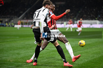 2024-11-23 - Rafael Leao of AC Milan and Nicolo Savona of Juventus FC during the Italian Serie A football match between AC Milan and FC Juventus on November 23, 2024 at Giuseppe Meazza San Siro Siro stadium in Milan, Italy - AC MILAN VS JUVENTUS FC - ITALIAN SERIE A - SOCCER