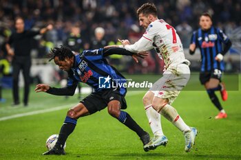 2024-10-30 - Juan CUADRADO of Atalanta and Georgios KYRIAKOPOULOS of AC Monza during the Italian championship Serie A football match between Atalanta BC and AC Monza on 30 October 2024 at Gewiss Stadium in Bergamo, Italy - ATALANTA VS MONZA - ITALIAN SERIE A - SOCCER