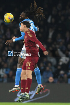 2024-11-24 - Niccolo Pisilli of AS Roma competes for the ball with Andre Frank Zambo Anguissa of SSC Napoli during the Serie A Enilive between SSC Napoli vs AS Roma at Diego Armando Maradona Stadium - SSC NAPOLI VS AS ROMA - ITALIAN SERIE A - SOCCER