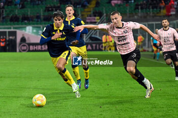 2024-01-20 - Kristoffer Lund (Palermo F.C.) in action against Fabio Ponsi (Modena F.C) during the Italian Serie BKT match between Palermo F.C. vs Modena F.C. 2018 on 20 January 2024 at the Renzo Barbera stadium in Palermo, Italy - PALERMO FC VS MODENA FC - ITALIAN SERIE B - SOCCER