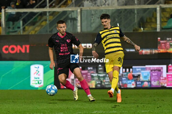 2024-04-19 - Kristoffer Lund (Palermo F.C.) in action against Dennis Man (Parma Calcio) during the Italian Serie BKT match between Palermo F.C. vs Parma Calcio 1913 on 19th April 2024 at the Renzo Barbera stadium in Palermo, Italy - PALERMO FC VS PARMA CALCIO - ITALIAN SERIE B - SOCCER