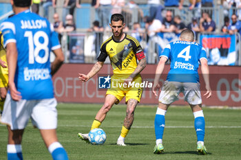 2024-04-06 - Marius Marin of Pisa Sporting Club 1909 carries the ball during the Italian Serie B soccer championship match between Brescia Calcio FC and Pisa SC 1909 at Mario Rigamonti Stadium on April 6, 2024, Brixia, Italy. - BRESCIA CALCIO VS PISA SC 1909 - ITALIAN SERIE B - SOCCER