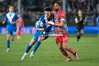 2024-09-30 - Ante Matteo Juric of Brescia Calcio FC contrasted by Matteo Biachetti of US Cremonese during the Italian Serie B soccer championship football match between Brescia Calcio FC and US Cremonese at Mario Rigamonti Stadium on September 30, 2024, Brixia, Italy. - BRESCIA CALCIO VS US CREMONESE - ITALIAN SERIE B - SOCCER