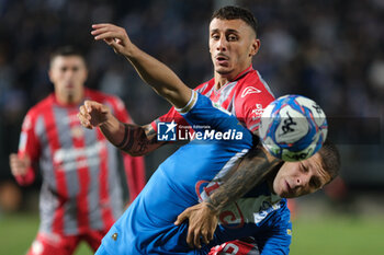 2024-09-30 - Michele Besaggio of Brescia Calcio FC contrasted by Michele Castagnetti of US Cremonese during the Italian Serie B soccer championship football match between Brescia Calcio FC and US Cremonese at Mario Rigamonti Stadium on September 30, 2024, Brixia, Italy. - BRESCIA CALCIO VS US CREMONESE - ITALIAN SERIE B - SOCCER