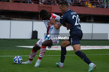 2024-10-06 - Davis Mensah of Mantova 1911 contrasted by Davide Adorni of Brescia Calcio FC during the Italian Serie B soccer championship football match between Mantova Calcio 1911 and Brescia Calcio FC at Danilo Martelli Stadium on October 6, 2024, Mantua, Italy. - MANTOVA 1911 VS BRESCIA CALCIO - ITALIAN SERIE B - SOCCER