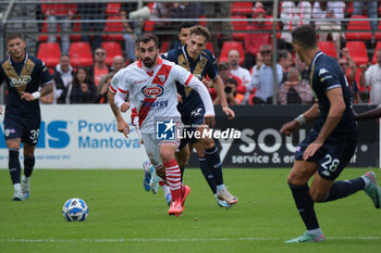 2024-10-06 - Simone Trimboli of Mantova 1911 followed by Giacomo Olzer of Brescia Calcio FC during the Italian Serie B soccer championship football match between Mantova Calcio 1911 and Brescia Calcio FC at Danilo Martelli Stadium on October 6, 2024, Mantua, Italy. - MANTOVA 1911 VS BRESCIA CALCIO - ITALIAN SERIE B - SOCCER