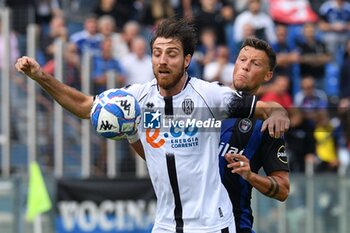 2024-10-05 - Simone Bastoni (Cesena) and Adrian Rus (Pisa) fight for the ball - AC PISA VS CESENA FC - ITALIAN SERIE B - SOCCER