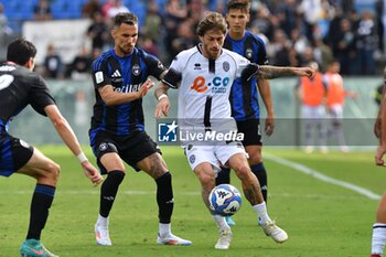 2024-10-05 - Mirko Antonucci (Cesena) thwarted by Marius Marin (Pisa) - AC PISA VS CESENA FC - ITALIAN SERIE B - SOCCER