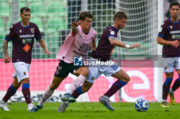 2024-10-26 - Luca Vido (A.C. Reggiana 1919) in action against Jacopo Segre (Palermo F.C.) during the Italian Serie BKT match between Palermo F.C. vs A.C. Reggiana 1919 on 26th October 2024 at the Renzo Barbera stadium in Palermo, Italy - PALERMO FC VS AC REGGIANA - ITALIAN SERIE B - SOCCER