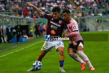 2024-10-26 - Matteo Maggio (A.C. Reggiana 1919) in action against Roberto Insigne (Palermo F.C.) during the Italian Serie BKT soccer match Palermo F.C. vs A.C. Reggiana 1919 at the Renzo Barbera Stadium, Palermo, Italy, 26th of October 2024 - PALERMO FC VS AC REGGIANA - ITALIAN SERIE B - SOCCER