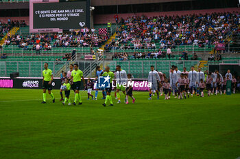 2024-10-26 - Palermo F.C. and A.C. Reggiana 1919 with the Arbitration Terna entering on the field during the Italian Serie BKT match between Palermo F.C. vs A.C. Reggiana 1919 on 26th October 2024 at the Renzo Barbera stadium in Palermo, Italy - PALERMO FC VS AC REGGIANA - ITALIAN SERIE B - SOCCER