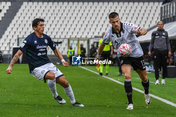 2024-11-24 - Arkadiusz Reca (Spezia) fights for the ball against Salvatore Andrea Molina (Sudtirol) - SPEZIA CALCIO VS FC SüDTIROL - ITALIAN SERIE B - SOCCER