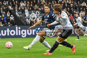 2024-11-24 - Duccio Degli Innocenti (Spezia) hampered by Mateusz Jakub Praszelik (Sudtirol) - SPEZIA CALCIO VS FC SüDTIROL - ITALIAN SERIE B - SOCCER