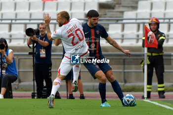 2024-09-28 - Alessandro Caporale of Cosenza in action against Giuseppe Sibilli of SSC Bari - SSC BARI VS COSENZA CALCIO - ITALIAN SERIE B - SOCCER