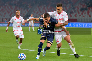 2024-10-18 - Mattia Compagnon of US Catanzaro 1929 in action against Mattia Maita of SSC Bari - SSC BARI VS US CATANZARO - ITALIAN SERIE B - SOCCER