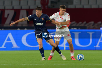 2024-10-18 - Ilias Koutsoupias of US Catanzaro 1929 in action against Costantino Favasulli of SSC Bari - SSC BARI VS US CATANZARO - ITALIAN SERIE B - SOCCER