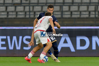 2024-10-18 - Mario Situm of US Catanzaro 1929 in action against Costantino Favasulli of SSC Bari - SSC BARI VS US CATANZARO - ITALIAN SERIE B - SOCCER