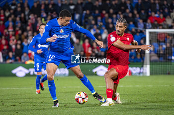 2024-01-16 - Mason Greenwood of Getafe seen in action with the ball against Loic Bade of Sevilla during the football match valid for the round of 16 of the Copa del Rey tournament between Getafe and Sevilla played at Estadio Coliseum in Getafe, Spain. - GETAFE VS SEVILLA - SPANISH CUP - SOCCER