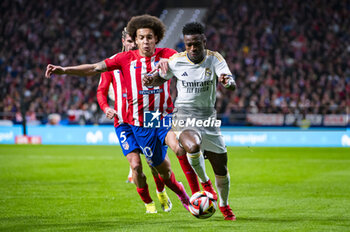 2024-01-18 - Vinicius Junior of Real Madrid seen in action with the ball against Axel Witsel of Atletico Madrid during the football match valid for the round of 16 of the Copa del Rey tournament between Atletico Madrid and Real Madrid played at Estadio Metropolitano in Madrid, Spain. - ATLETICO MADRID VS REAL MADRID - SPANISH CUP - SOCCER
