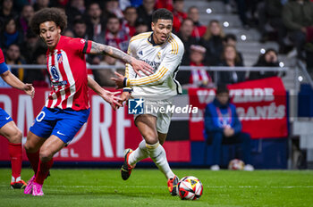 2024-01-18 - Jude Bellingham of Real Madrid seen in action with the ball against Axel Witsel of Atletico Madrid during the football match valid for the round of 16 of the Copa del Rey tournament between Atletico Madrid and Real Madrid played at Estadio Metropolitano in Madrid, Spain. - ATLETICO MADRID VS REAL MADRID - SPANISH CUP - SOCCER