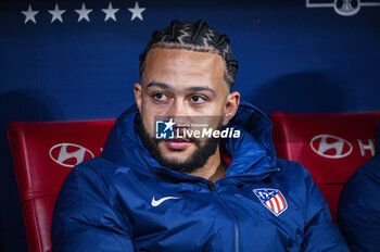 2024-01-25 - Memphis Depay of Atletico Madrid seen sitting in the bench before the football match valid for quarter finals of the Copa del Rey tournament between Atletico Madrid and Sevilla played at Estadio Metropolitano in Madrid, Spain. - ATLETICO MADRID VS SEVILLA - SPANISH CUP - SOCCER