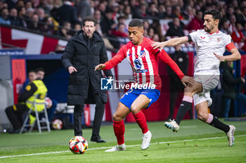 2024-01-25 - Samuel Lino of Atletico Madrid seen in action with the ball against Jesus Navas of Sevilla during the football match valid for quarter finals of the Copa del Rey tournament between Atletico Madrid and Sevilla played at Estadio Metropolitano in Madrid, Spain. - ATLETICO MADRID VS SEVILLA - SPANISH CUP - SOCCER