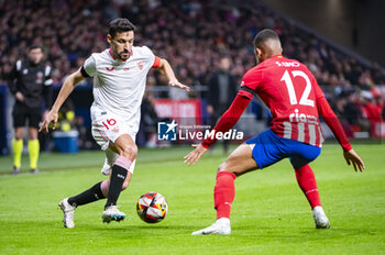 2024-01-25 - Jesus Navas of Sevilla seen in action with the ball against Samuel Lino of Atletico Madrid during the football match valid for quarter finals of the Copa del Rey tournament between Atletico Madrid and Sevilla played at Estadio Metropolitano in Madrid, Spain. - ATLETICO MADRID VS SEVILLA - SPANISH CUP - SOCCER
