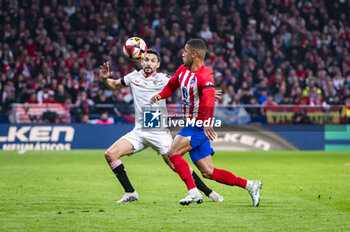 2024-01-25 - Samuel Lino of Atletico Madrid seen in action against Jesus Navas of Sevilla during the football match valid for quarter finals of the Copa del Rey tournament between Atletico Madrid and Sevilla played at Estadio Metropolitano in Madrid, Spain. - ATLETICO MADRID VS SEVILLA - SPANISH CUP - SOCCER