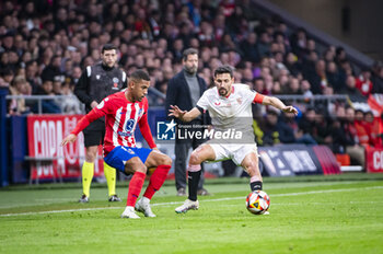 2024-01-25 - Jesus Navas of Sevilla seen in action against Samuel Lino of Atletico Madrid during the football match valid for quarter finals of the Copa del Rey tournament between Atletico Madrid and Sevilla played at Estadio Metropolitano in Madrid, Spain. - ATLETICO MADRID VS SEVILLA - SPANISH CUP - SOCCER