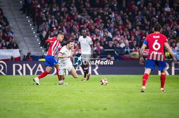 2024-01-25 - Jesus Navas of Sevilla seen receiving a foul by Samuel Lino of Atletico Madrid during the football match valid for quarter finals of the Copa del Rey tournament between Atletico Madrid and Sevilla played at Estadio Metropolitano in Madrid, Spain. - ATLETICO MADRID VS SEVILLA - SPANISH CUP - SOCCER