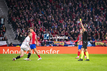 2024-01-25 - Ivan Rakitic of Sevilla is warned with a yellow card by the referee during the football match valid for quarter finals of the Copa del Rey tournament between Atletico Madrid and Sevilla played at Estadio Metropolitano in Madrid, Spain. - ATLETICO MADRID VS SEVILLA - SPANISH CUP - SOCCER