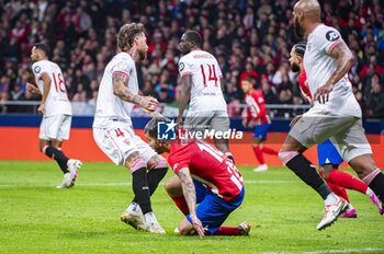 2024-01-25 - Sergio Ramos of Sevilla seen helping Angel Correa of Atletico Madrid during the football match valid for quarter finals of the Copa del Rey tournament between Atletico Madrid and Sevilla played at Estadio Metropolitano in Madrid, Spain. - ATLETICO MADRID VS SEVILLA - SPANISH CUP - SOCCER