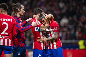 2024-01-25 - Jorge Resurreccion Merodio (Koke) of Atletico Madrid and Angel Correa of Atletico Madrid seen celebrating the victory at the end of the football match valid for quarter finals of the Copa del Rey tournament between Atletico Madrid and Sevilla played at Estadio Metropolitano in Madrid, Spain. - ATLETICO MADRID VS SEVILLA - SPANISH CUP - SOCCER