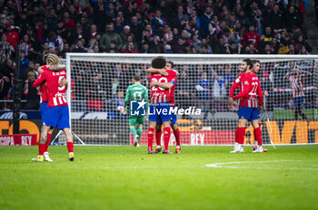2024-01-25 - Rodrigo De Paul, Axel Witsel, Jorge Resurreccion Merodio (Koke), Mario Hermoso and Jose Gimenez of Atletico Madrid seen celebrating the victory at the end of the football match valid for quarter finals of the Copa del Rey tournament between Atletico Madrid and Sevilla played at Estadio Metropolitano in Madrid, Spain. - ATLETICO MADRID VS SEVILLA - SPANISH CUP - SOCCER