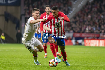 2024-02-07 - Samuel Lino of Atletico Madrid seen in action against Inigo Ruiz de Galarreta of Athletic Bilbao during the football match valid for the semi-final of the Copa del Rey tournament between Atletico Madrid and Athletic Bilbao played at Estadio Metropolitano in Madrid, Spain. - ATLETICO MADRID VS ATHLETIC BILBAO - SPANISH CUP - SOCCER