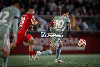 2024-10-31 - Angel Correa (Atletico de Madrid) and Pius Quer (UE Vic) battle for the ball during a Copa del Rey match between UE Vic and Atletico de Madrid at Estadi Hipolit Planas in Vic, Barcelona, Spain, on October 31 2024. Photo by Felipe Mondino - UE VIC - ATLETICO DE MADRID - SPANISH CUP - SOCCER