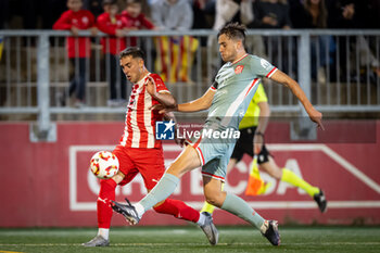 2024-10-31 - Didac Serra (UE Vic) and Ilias Kostis (Atletico de Madrid) battle for the ball during a Copa del Rey match between UE Vic and Atletico de Madrid at Estadi Hipolit Planas in Vic, Barcelona, Spain, on October 31 2024. Photo by Felipe Mondino - UE VIC - ATLETICO DE MADRID - SPANISH CUP - SOCCER