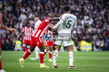 2024-01-21 - Dion Lopy (L) of Almeria seen fighting with Jude Bellingham (R) of Real Madrid during the La Liga EA Sports 23/24 football match between Real Madrid vs Almeria at Bernabeu stadium in Madrid, Spain. - REAL MADRID VS ALMERIA - SPANISH LA LIGA - SOCCER