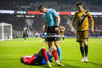 2024-01-31 - Rodrigo Riquelme of Atletico Madrid seen injured on the ground wit the referee checking his conditions during the La Liga EA Sports 2023/24 football match between Atletico Madrid vs Rayo Vallecano at Metropolitano stadium in Madrid, Spain. - ATLETICO MADRID VS RAYO VALLECANO - SPANISH LA LIGA - SOCCER