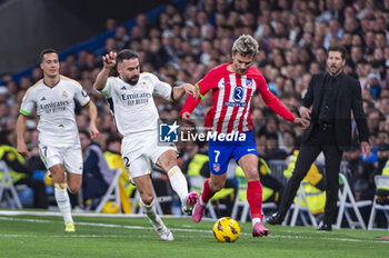 2024-02-04 - Antoine Griezmann of Atletico Madrid seen in action with the ball against Daniel Carvajal of Real Madrid during the La Liga EA Sports 2023/24 football match between Real Madrid vs Atletico Madrid at Santiago Bernabeu stadium in Madrid, Spain. - REAL MADRID VS ATLETICO MADRID - SPANISH LA LIGA - SOCCER